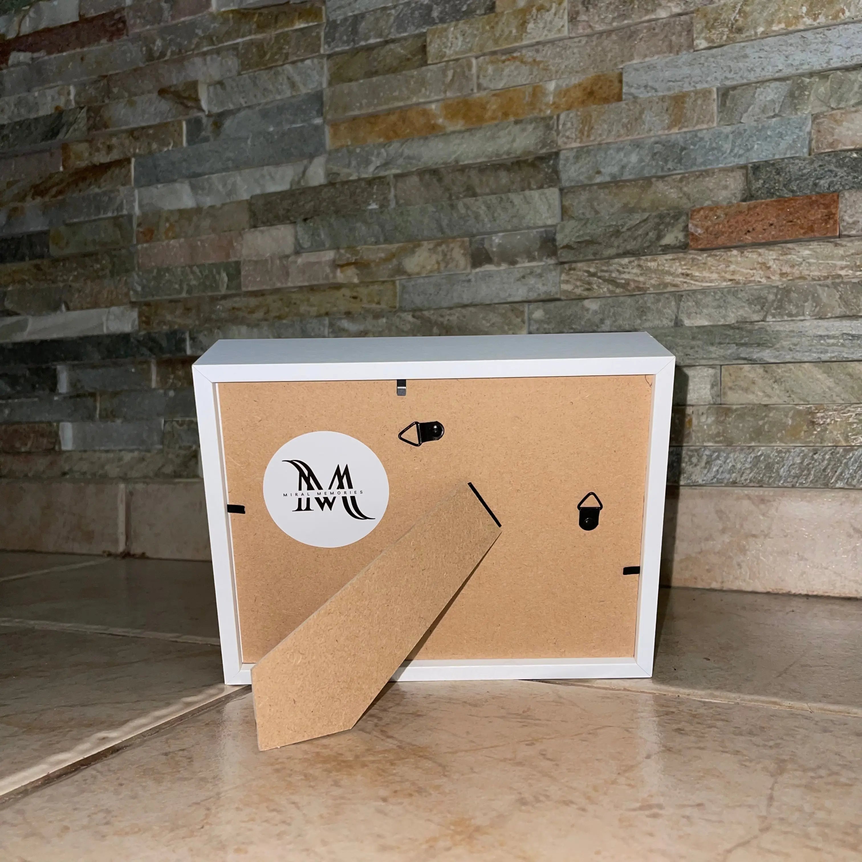 Cardboard box with a logo on a stone wall background